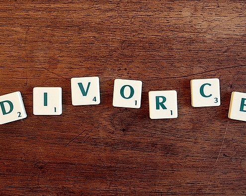 Does a spouse have to agree to a divorce in Clinton County, Michigan?