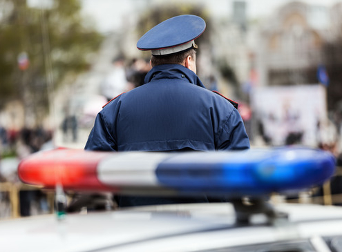 How does an individual report a police officer in Gainesville, Florida for misconduct?